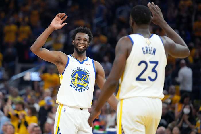 Jun 13, 2022; San Francisco, California, USA; Golden State Warriors forward Andrew Wiggins (22) and forward Draymond Green (23) celebrate during the first half in game five of the 2022 NBA Finals against the Boston Celtics at Chase Center. Mandatory Credit: Kyle Terada-USA TODAY Sports